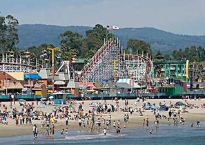 A beach with a roller coaster and amusement park in the background. - Steps to Beach & Boardwalk, Cozy Room, Fast WiFi, Private Bath, Coffee+Snacks #4 (Santa Cruz)