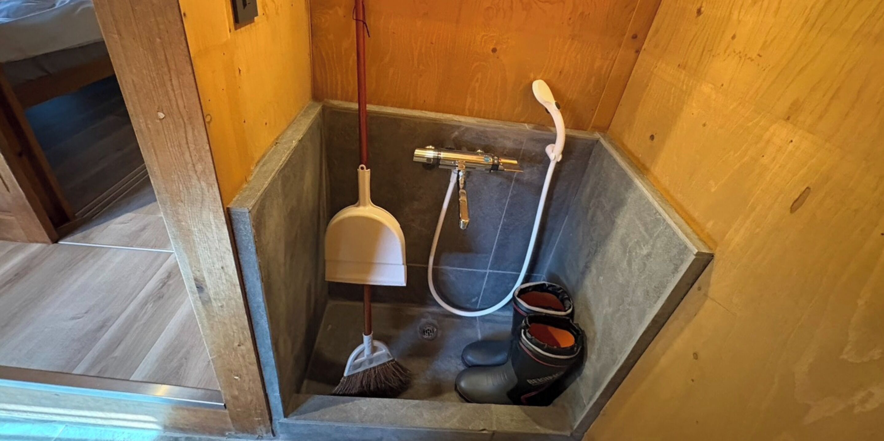 A small, square-shaped bathroom with a shower, a handheld showerhead, a handheld showerhead, a handheld showerhead, a handheld showerhead, a handheld showerhead, a handheld showerhead, a handheld showerhead, a handheld showerhead, a handheld showerhead, a handheld showerhead, a handheld showerhead, a handheld showerhead, a handheld showerhead, a handheld showerhead, a handheld showerhead, a handheld showerhead, a handheld showerhead, a handheld showerhead, a handheld showerhead, a handheld showerhead, a handheld showerhead, a handheld showerhead, a handheld showerhead, a handheld showerhead, a handheld showerhead, a handheld showerhead, a handheld showerhead, a handheld showerhead, a handheld showerhead, a handheld showerhead, a handheld showerhead, a handheld showerhead, a handheld showerhead, a handheld showerhead, a handheld showerhead, a handheld showerhead, a handheld showerhead, a handheld