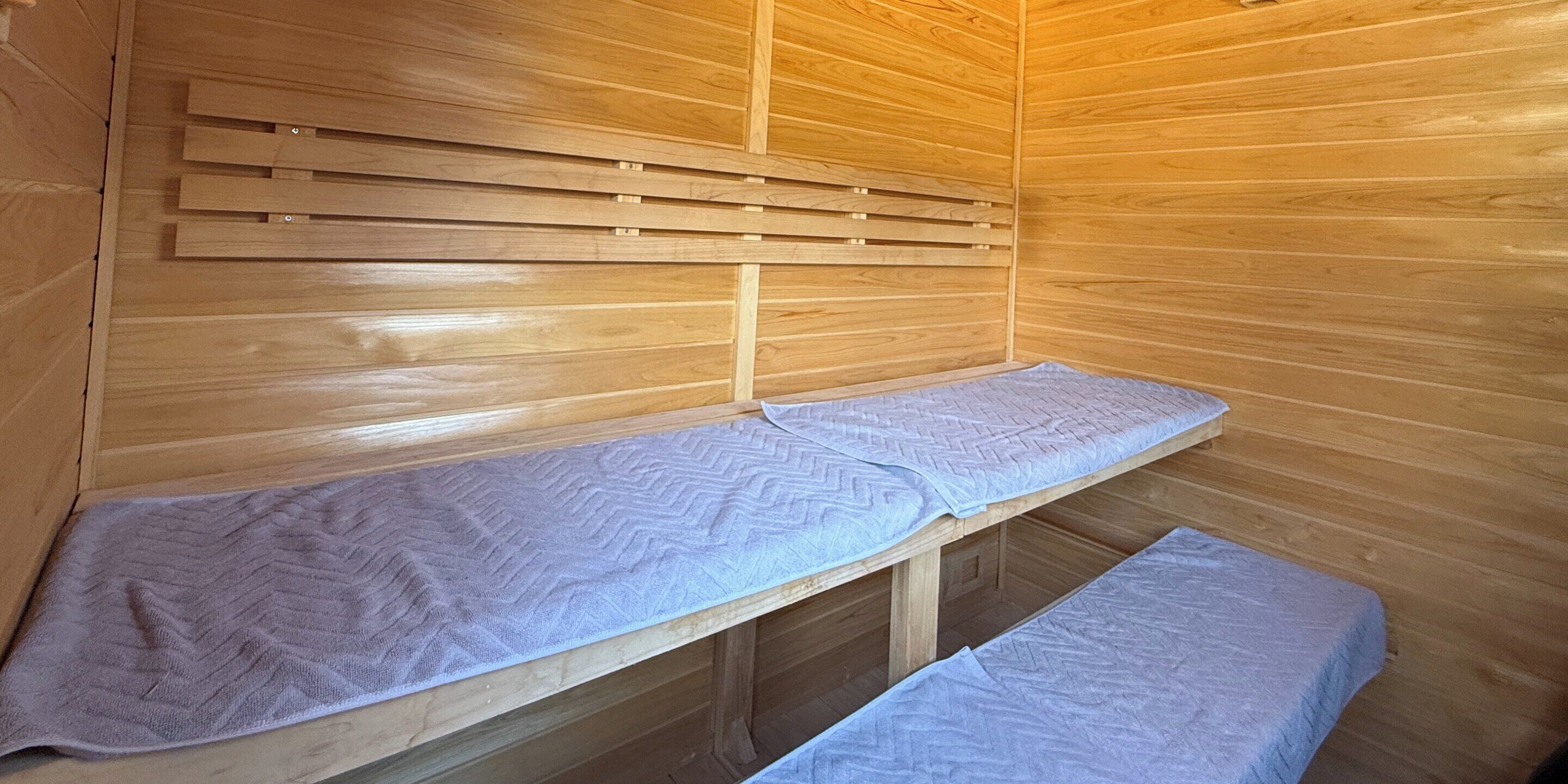 A sauna with wooden walls and benches.