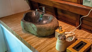 A kitchen with a stone sink, a coffee maker, and a microwave on the countertop. - Pada Wareg Villas, Ubud by Sidhi Hospitality Experiences (Gianyar)