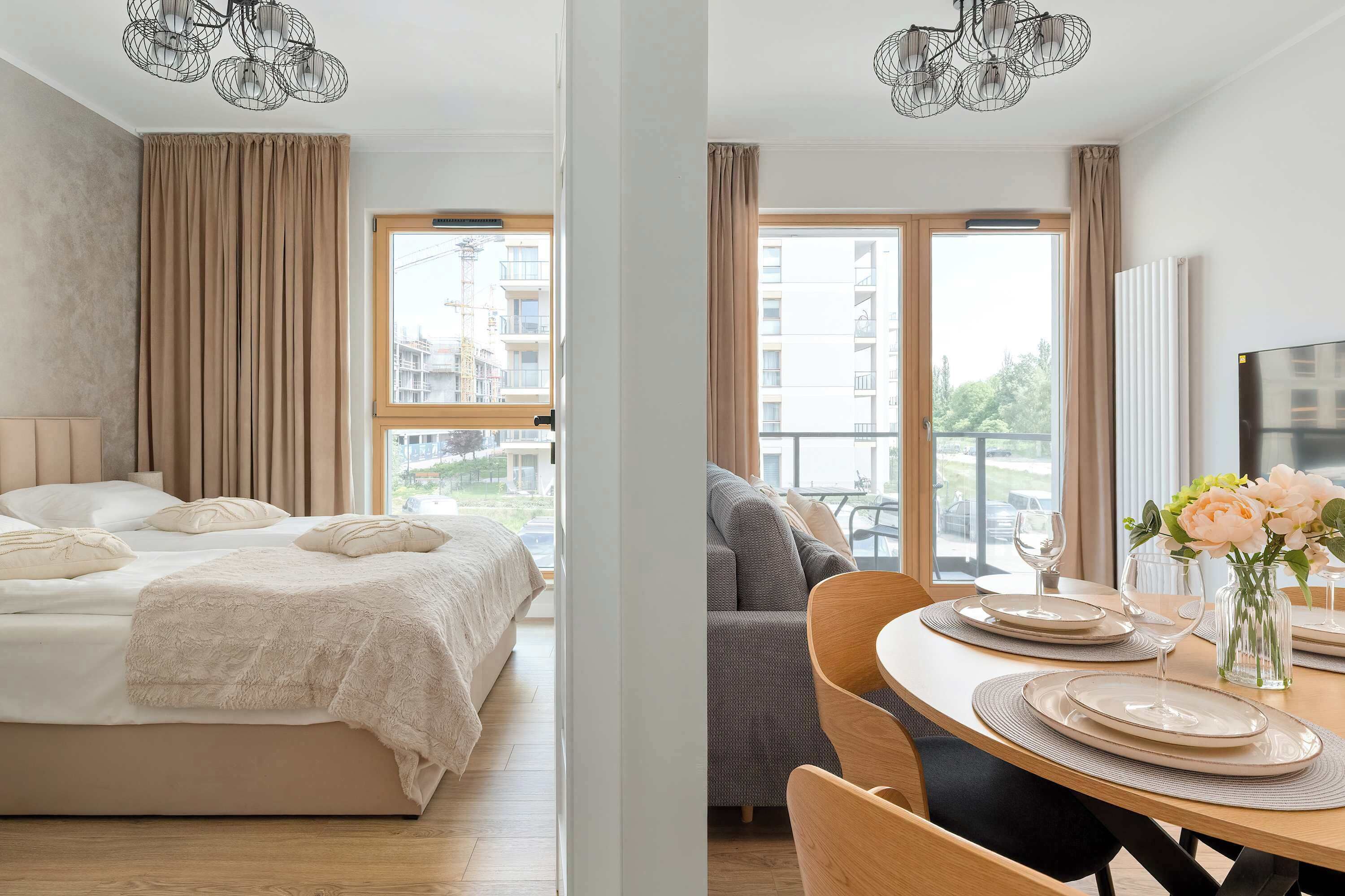 Apartment featuring a separate bedroom and a bright living area with dining space.