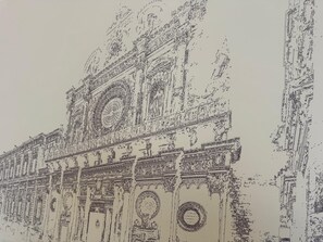 A detailed architectural drawing of a classical building with ornate columns, a central dome, and intricate decorative elements.