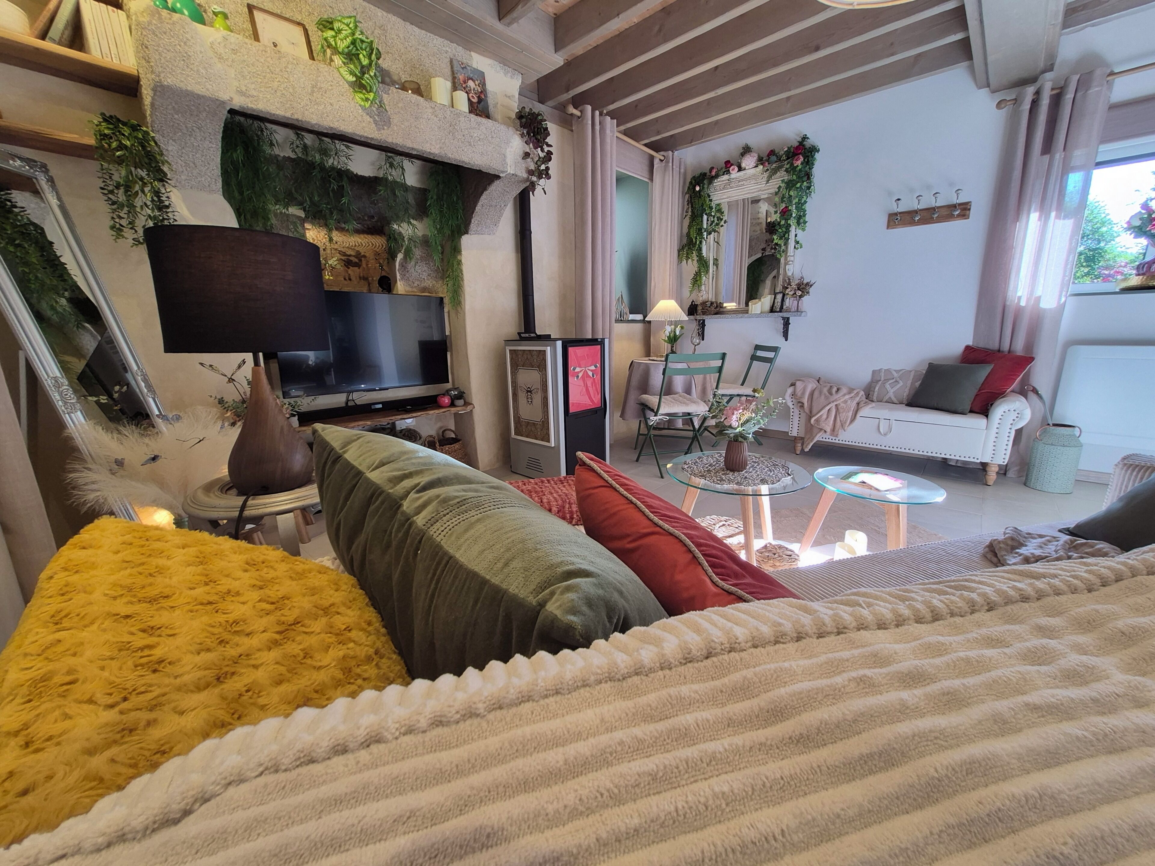 A cozy living room with a fireplace, television, and comfortable seating.. La Nuit D'Etang
