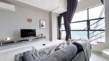 Deluxe Duplex, 2 Bedrooms | Living area | 43-inch LED TV with digital channels