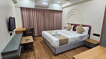 Deluxe Double Room, City View | In-room safe, desk, laptop workspace, iron/ironing board