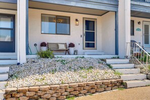 A house with a porch, a bench, a potted plant, and a sign that reads 'Beach House.' - West End PCB: Partial Gulf Views | Steps to Beach (Panama City Beach)