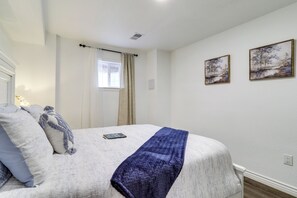 A bedroom with a bed, a window with curtains, and two wall-mounted paintings. - 5 Mi to Barr Lake! Suburban Family Retreat (Brighton)