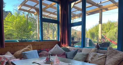 The Big House, a sanctuary in a lush valley bordering the Abel Tasman NP.