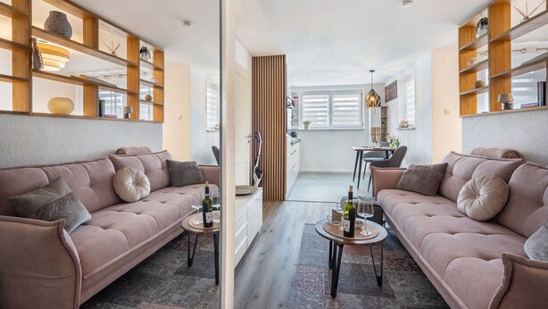 A modern living room with two sofas, a coffee table, and a dining area with a table and chairs. - Apartment 'Wohlfühlappartement Sonnenhalde' with Private Terrace, Garden & Wi-Fi (Sigmarszell)