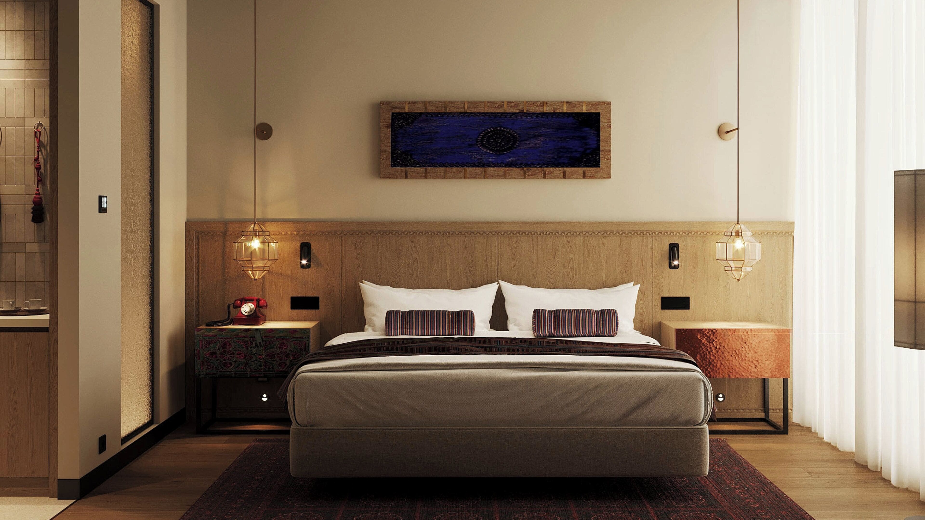 A hotel room with a large bed, two bedside tables, a wall-mounted artwork, and a television.