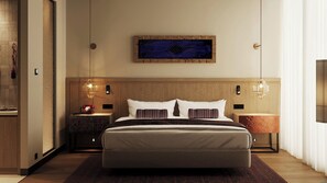 Habitación de hotel con una cama grande, dos mesitas de noche, una obra de arte en la pared y un televisor.