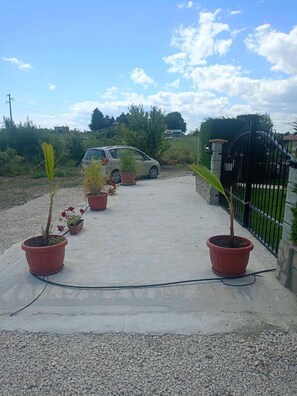 A paved driveway with potted plants and a parked car. - Villa Bellerose direct seaview, 4 bedrooms, private heated pool - golf - beaches (Bozhurets)