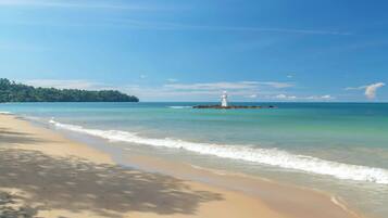 On the beach, white sand, beach towels, beach yoga