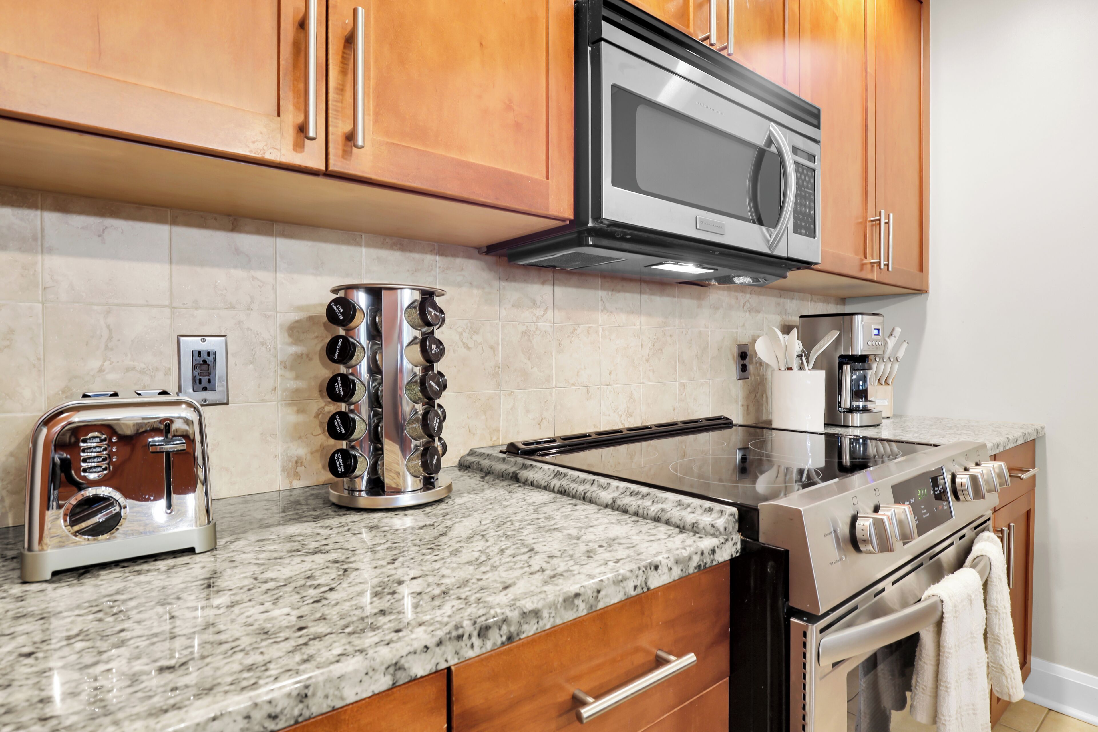 The fully stocked kitchen features reliable appliances and ample counter space for meal prepping.