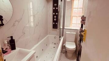 Hair dryer, bidet, towels, soap