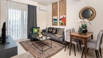 Deluxe appartement, balkon | Woonruimte