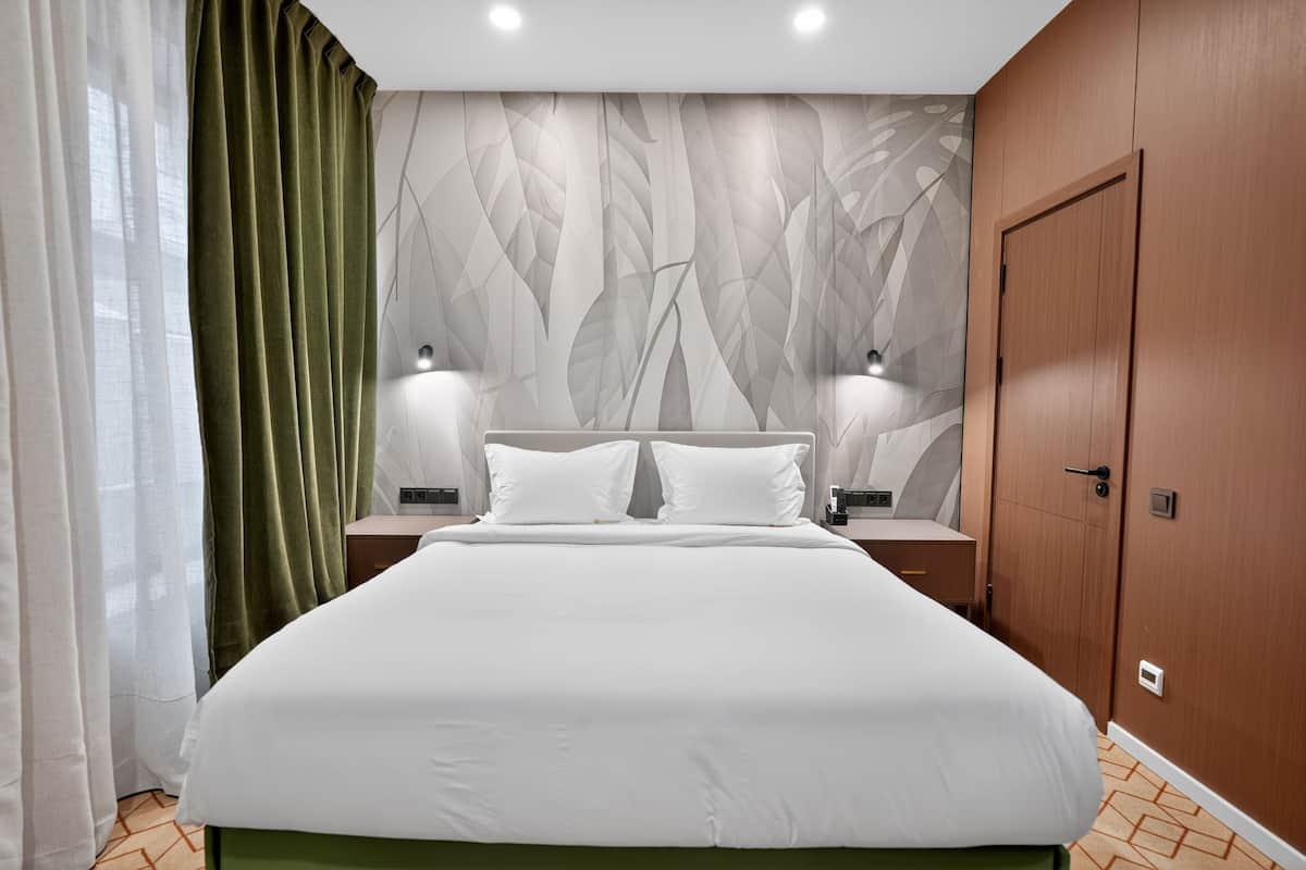 Habitació doble estàndard | Matalassos de la marca Select Comfort i cortines opaques 