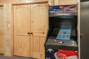 A wooden door with a keypad lock and a control panel with a screen and buttons. - 🌲 70 Acre Mountain Farmstead 🏞️ Stocked Pond, Game Room & Seclusion (Sevierville)