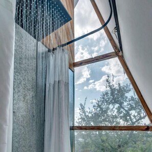 A room with a large window, wooden beams, and a curtain. - One-of-a-Kind Cliffside Glamping Experience with Sky Views in Cottonwood Shores, Texas (Cottonwood Shores)