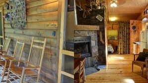 Interior rústico de una cabaña con chimenea de piedra, mobiliario de madera y un letrero que dice 'Vol. Lodge'.