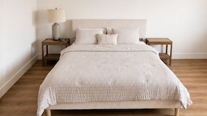 A bedroom with a bed, nightstands, a ceiling fan, and LED strip lighting. - Conveniently located Spacious Houston Heights Home-King Suite-Sleeps 6 (Houston)
