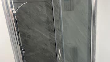 Combined shower/bathtub, deep-soaking bathtub, hair dryer, towels