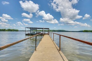 A pier extending into a lake with a covered area at the end. - Steps to Pickwick Lake! Home w/ Sunrooms & Views (Cherokee)