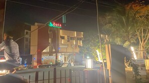 A building with a sign reading 'Buta' and a gated entrance.