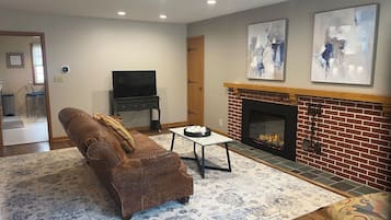 Smart TV, fireplace, books