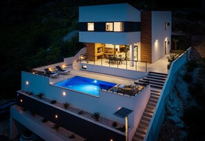 A modern two-story house with a swimming pool, outdoor seating, and a staircase. - Seaview Villa EBS, Your Mediterranean Retreat (Lokva Rogoznica)