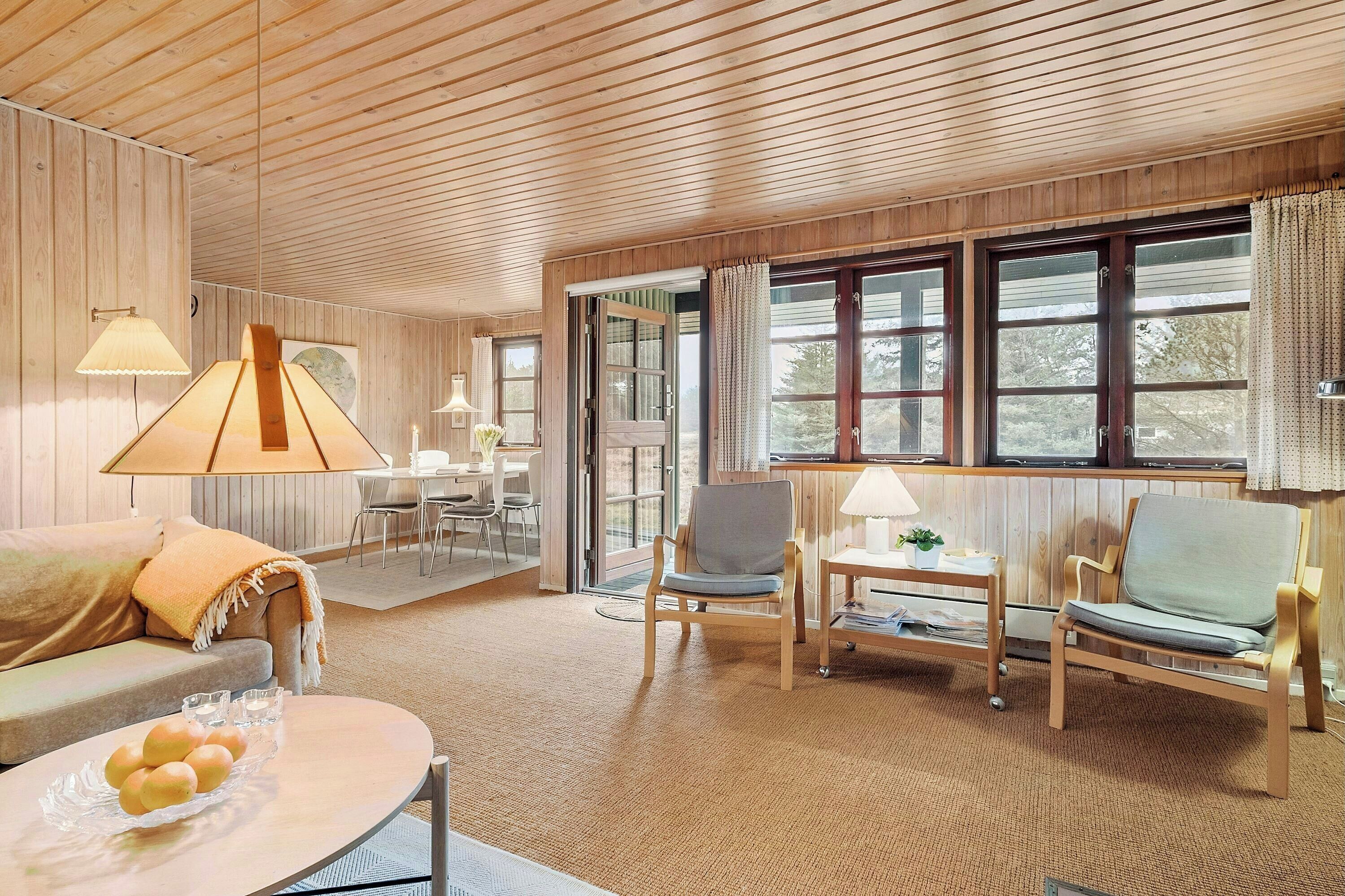 Living area. Holiday home in coastal nature with turf roof