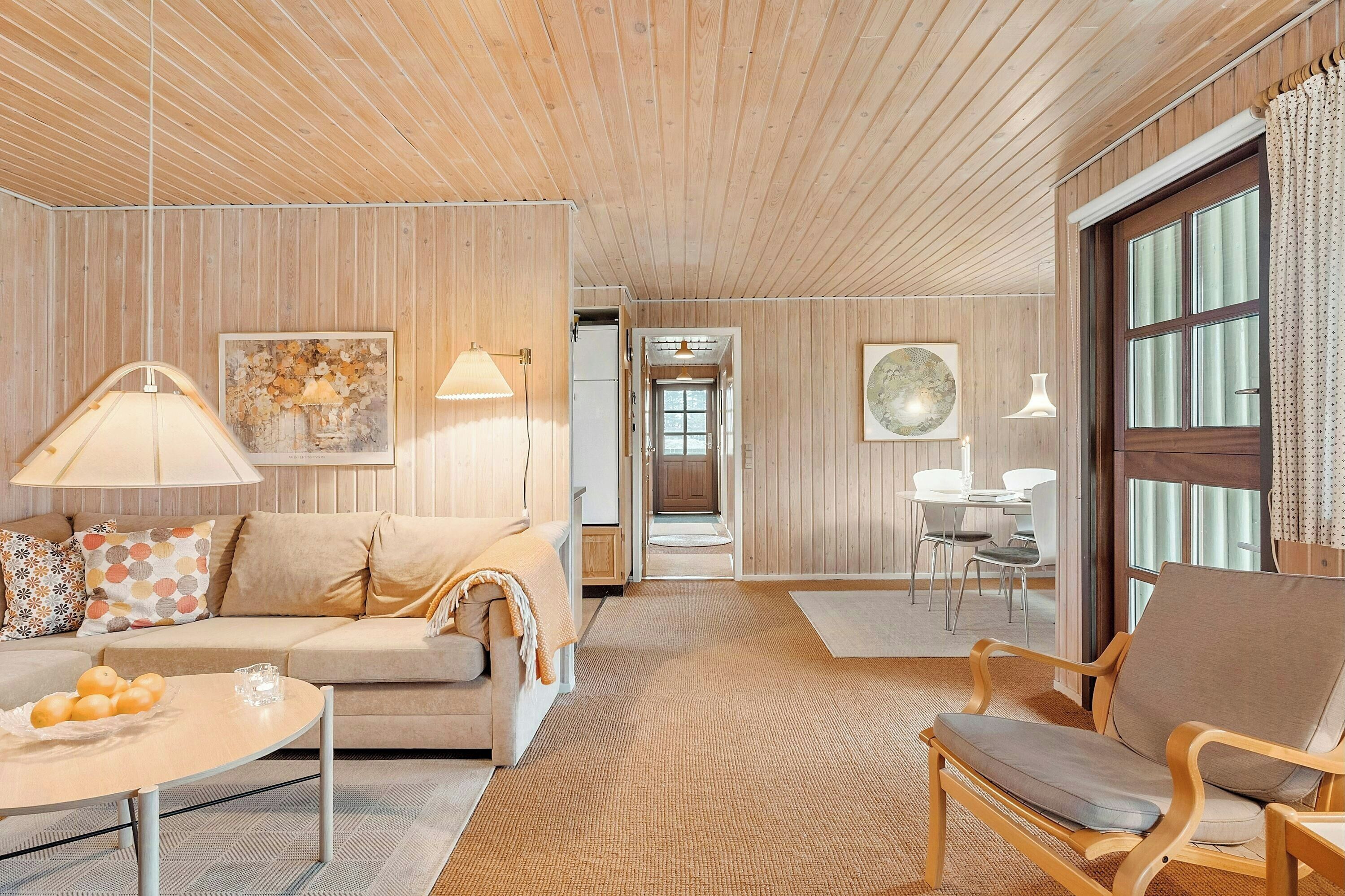 Living area. Holiday home in coastal nature with turf roof