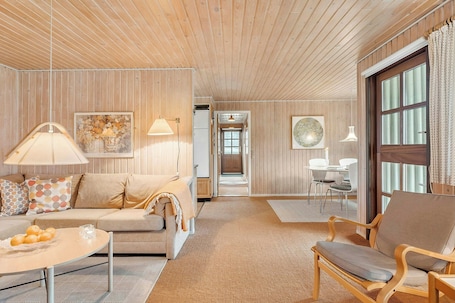 Living area. Holiday home in coastal nature with turf roof