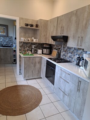 Comfort Cottage, Patio, Beach View | Private kitchen - BayView Guest House  (Jeffreys Bay)
