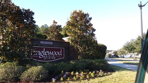 A sign for a property named 'inglewood' with a brick wall and decorative foliage. - Relax & unwind in a spacious 3-bedroom townhouse with 4 beds in Barefoot Resorts (North Myrtle Beach)