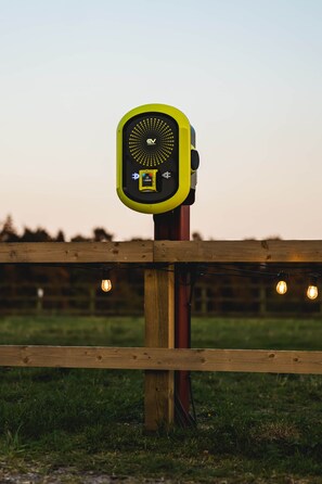 A device mounted on a wooden post with a grassy field in the background. - 6 Henham Barns, Henham Park, Nr Southwold, Suffolk (Suffolk)