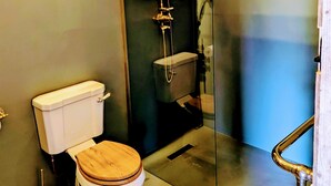 A bathroom with a toilet, a shower enclosure, and a glass door. - 6 Henham Barns, Henham Park, Nr Southwold, Suffolk (Suffolk)
