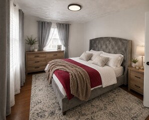 A bedroom with a bed, bedside tables, a nightstand, a dresser, a window with curtains, and a ceiling light. -     Stylish 3BR Retreat Minutes from NYC & World Cup Events (City of Orange)
