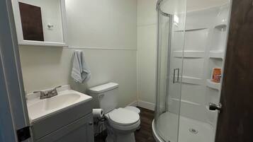 Shower, towels, soap, toilet paper
