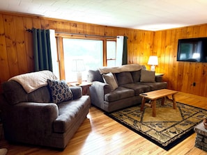 Living area - Adirondack Waterfront Camp on First Lake - 5BR - Private docks (Old Forge)