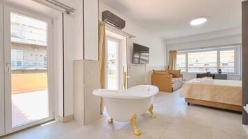 Deluxe Triple Room, City View | In-room safe, laptop workspace, blackout curtains, soundproofing