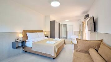 Deluxe Triple Room, City View | In-room safe, laptop workspace, blackout curtains, soundproofing
