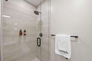 Shower, hair dryer, towels, shampoo