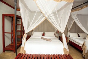 A room with a bed under a canopy, a wooden bench, and a wooden ladder. - Oxpecker Safari Lodge (Mfuwe)