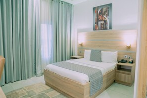 In-room safe, desk, laptop workspace, blackout curtains - OTI Hotel (Benin City)