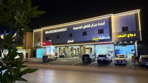 A hotel with a sign for 'KHAYAL SUITES SERVICED APARTMENTS' and a visible entrance. - khayal suites (Riyadh)