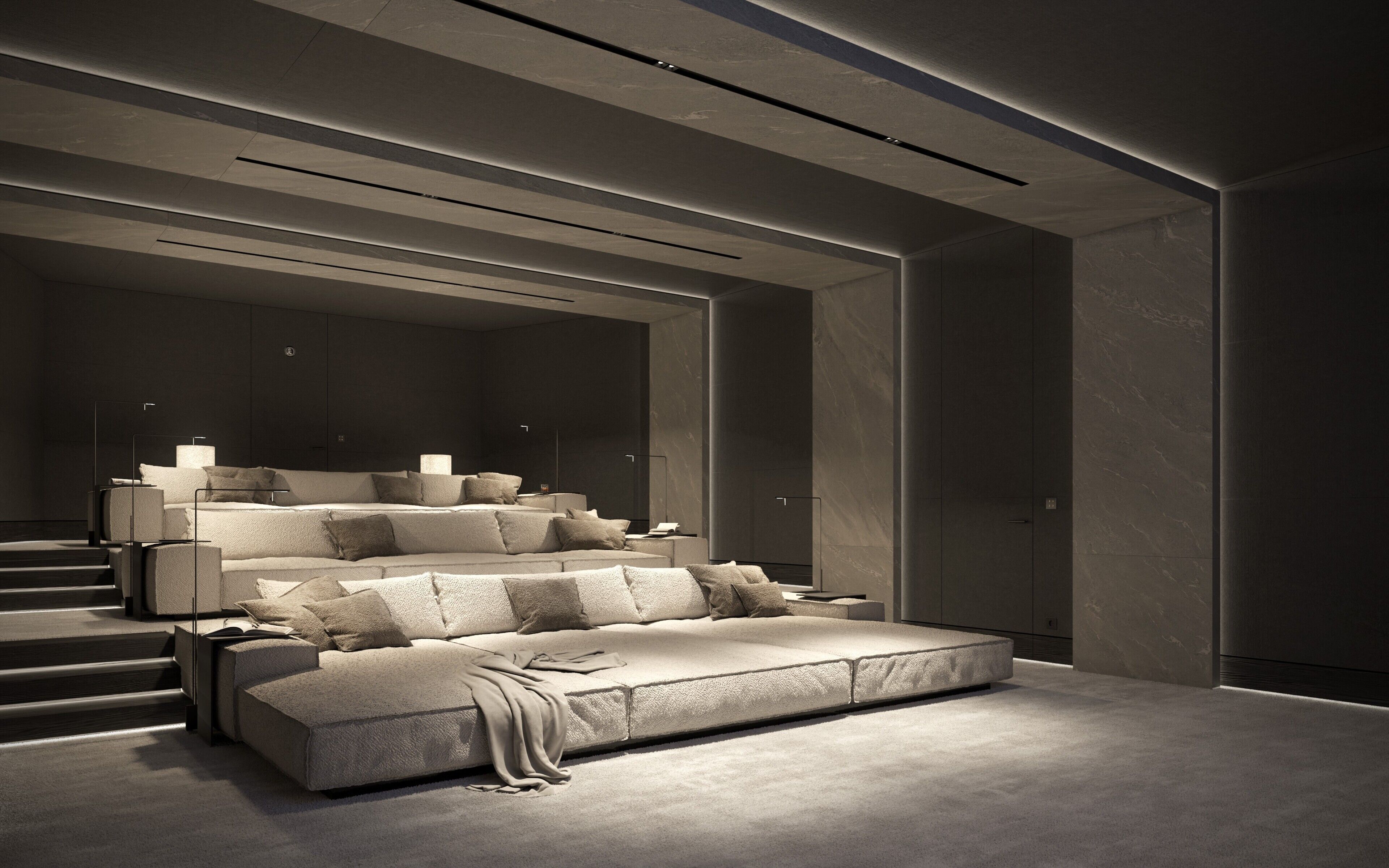 A modern hotel room with a large bed, a sofa, and a desk.
