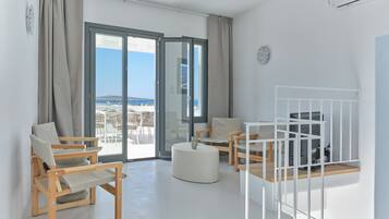 Duplex, Partial Sea View | Living area | 34-inch flat-screen TV with cable channels