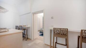 Suite Deluxe, balcón, vista a la ciudad | Interior
