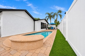 Private swimming pool surrounded by a fully fenced backyard, providing a peaceful and private setting for relaxation and family fun. - Private Pool Retreat in Tampa | 5BR/5BA Vacation Home (Tampa)
